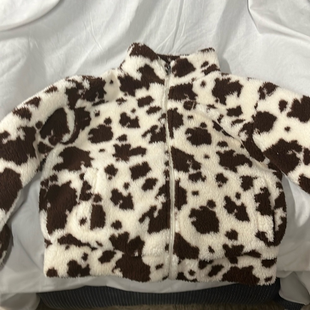 RSQ Cow print Sherpa zippered jacket from Tillys